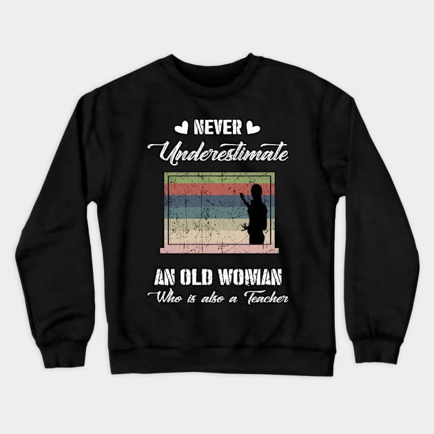 Never Underestimate An Old Woman Teacher Crewneck Sweatshirt by Rojio